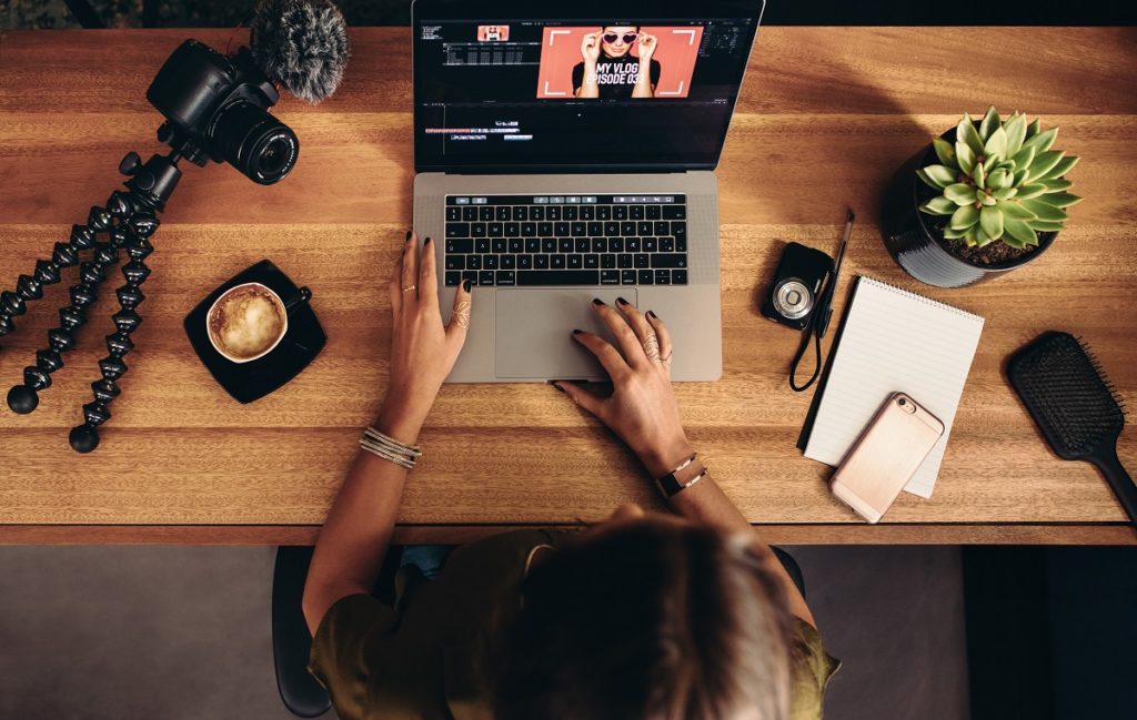 Woman editing a video on her laptop