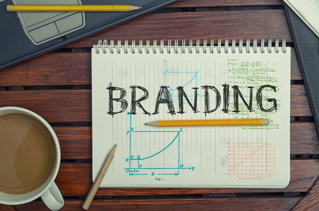 branding business concept on notebook with pencils and coffee